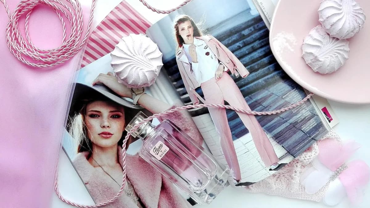 Fashion flat lay with a magazine, accessories and pink tones