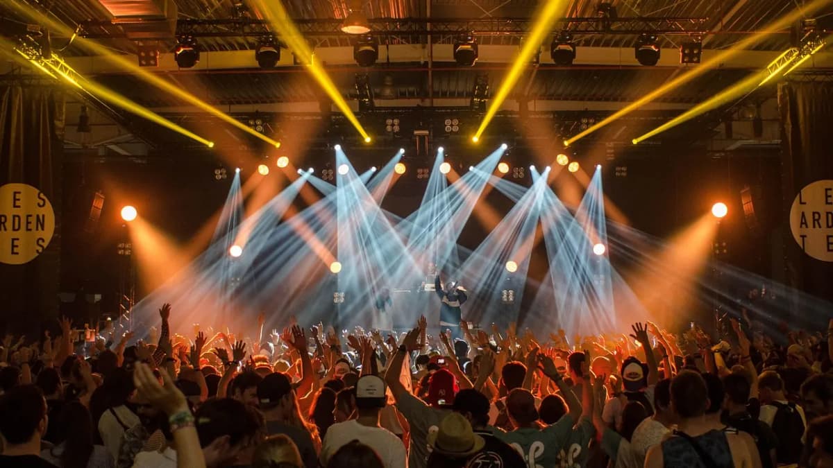 Concert crowd under bright stage lights