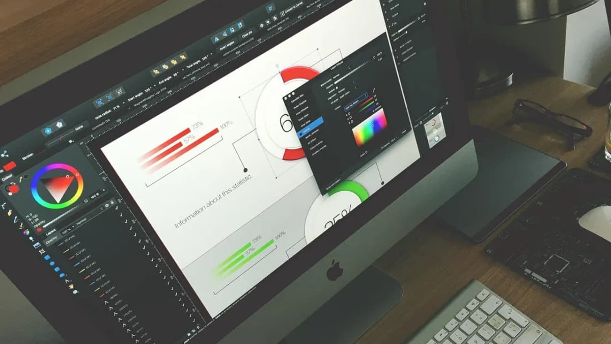 Design software open on a large monitor in a studio workspace